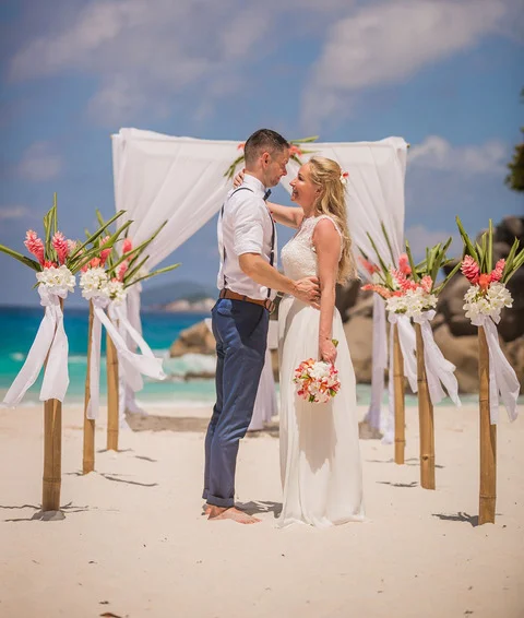 Couple holding each other at Wedding entrance in Seychelles