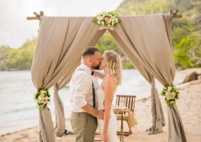 Jennifer Daniel kissing at the wedding entrance