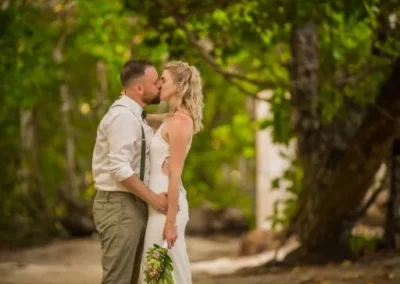 Jennifer Daniel is kissing where there are trees around