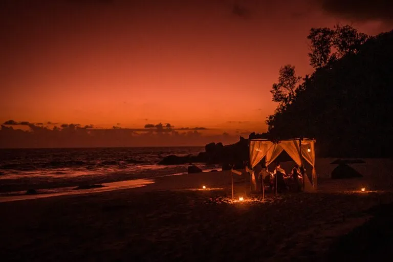 Jeanette & Nick – candlelit dinner pavilion on the beach at sunset